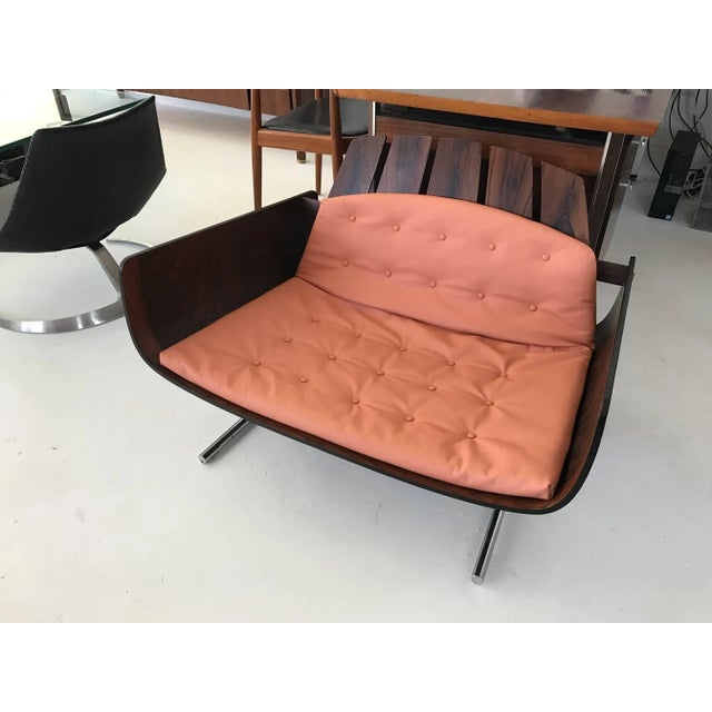 A rare piece of Brazilian modern design, the "presidencial" lounge chair with arms was designed by Jorge Zalszupin (b....