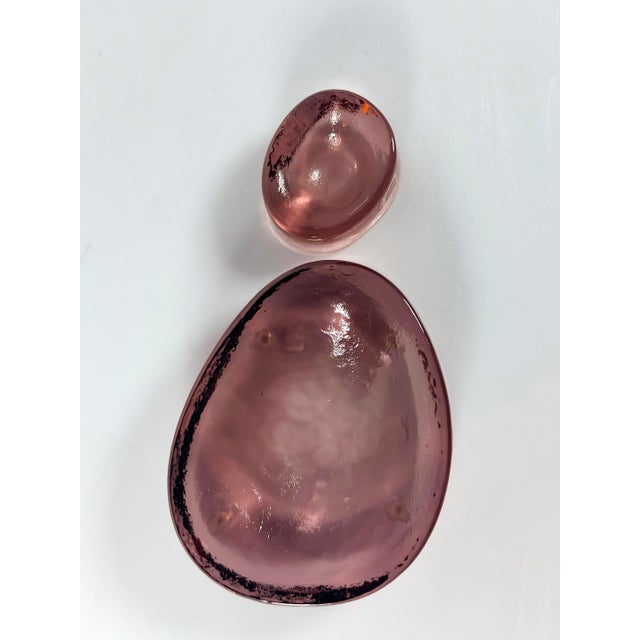 Set of two pinkish-purple Murano glass trinket trays. New, signed, and with original tags. The size indicated corresponds...