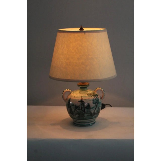 Petite Qing Dynasty table lamp.Beautiful hand painted scenic detail, creating a visually interesting piece. Hand painted...