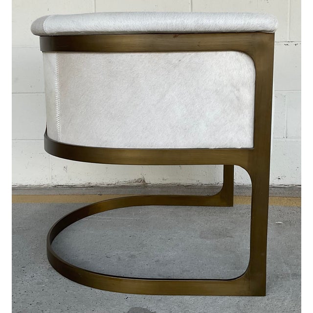 Original retail $2577, stylish Global Views Modern Hair on Hide Barrel Back Regan Lounge Chair, bronze finished metal...