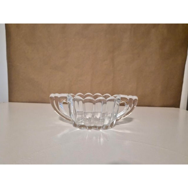 Bring timeless elegance to your table with this vintage Heisey Crystolite sugar and creamer set, produced by A.H. Heisey &...
