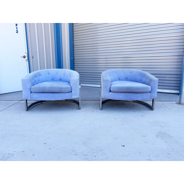 Infuse mid-century glamour into your interior with this striking pair of low-slung barrel lounge chairs, styled in the...