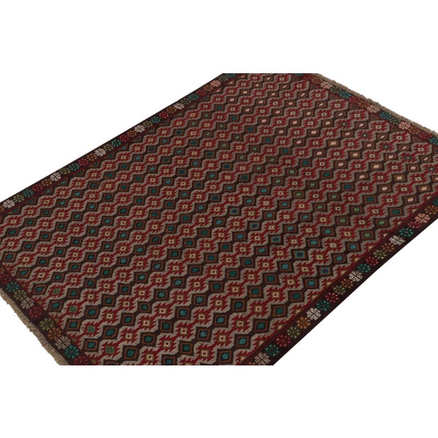 Hand knotted in wool, this 6x8 Baluch rug represents a new line of tribal carpets in the Modern Classics Collection by Rug...