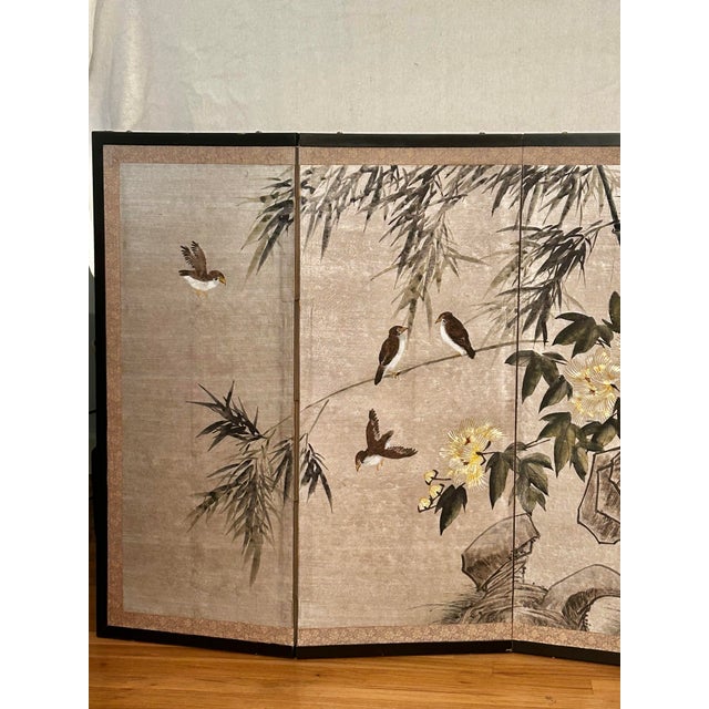 This is a graceful vintage four-panel Chinese folding screen featuring a serene hand-painted Chinoiserie landscape with...