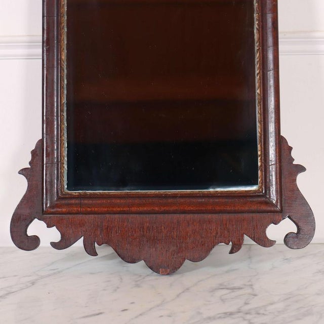 Small 1920's Georgian style mahogany and gilt mirror. W: 35cm (13.8")H: 57cm (22.4")D: 3cm (1.2") This piece is designed...