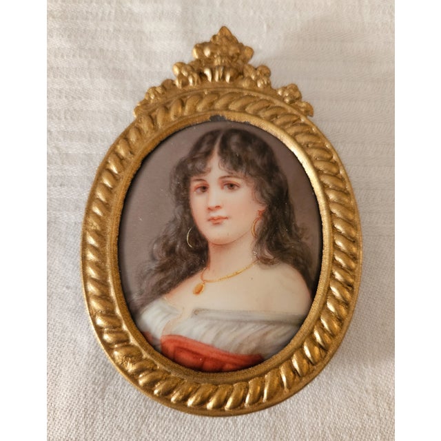 This marvelous miniature portrait is created in gorgeous porcelain and is hand-painted with a very lovely young lady with...