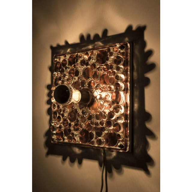 Wonderful "water droplets" wall lamp by peill & putzler germany, 1970s. The lamp has a beautiful light effect because of...