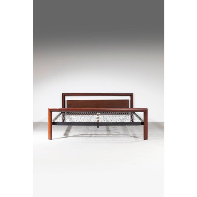 Bed model L108 designed by Eugenio Gerli and produced by Tecno in 1967. The frame is made of solid walnut. Bibl.: Giuliana...