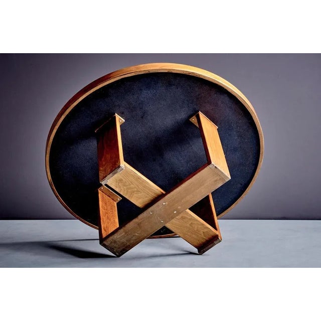 Round coffee table by Heinz Lilienthal with a mosaic stone top set in circular inlays of varying sizes and tones, framed...