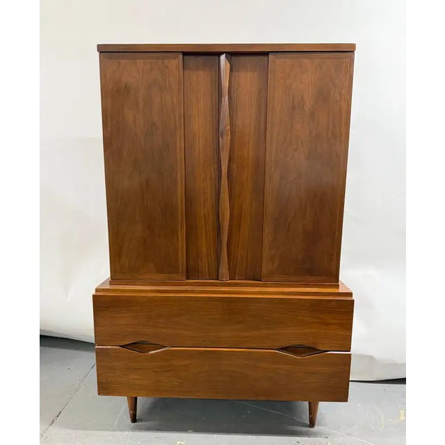 Mid-Century Modern American of Martinsville Walnut High Boy Dresser or Armoire This Mid-Century Modern walnut armoire by...