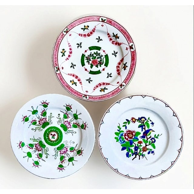 A beautifully curated set of three vintage Chinese decorative plates, each measuring 10.5 inches and featuring its own...
