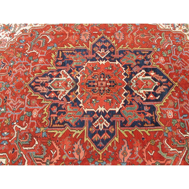 Islamic Antique Heriz Rug With Stylized Central Medallion Set on Tomato Red Field For Sale - Image 3 of 9