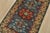 A tribal Caucasian Kazak rug hand-knotted with fine wool on a cotton foundation. This rug features a central medallion...