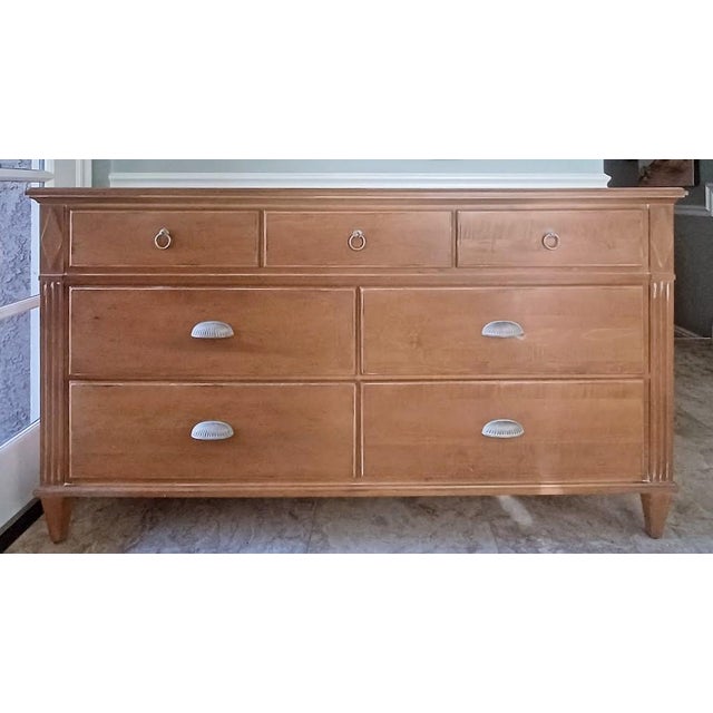 This beautiful 7 drawer dresser is made by Ethan Allen in the Swedish Collection. The color is antique pecan, finish #230....
