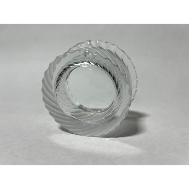 A fine example of French crystal artistry, this Lalique "Smyrne" Ashtray showcases the timeless elegance and craftsmanship...