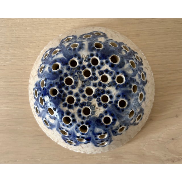 A charming American studio pottery berry colander, hand-thrown in speckled stoneware and decorated in cobalt blue, cream,...