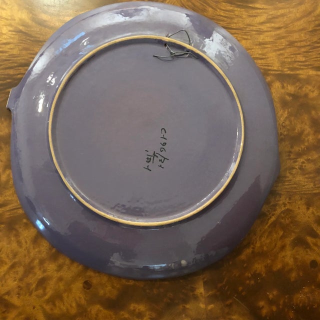 Colorful enamel abstract pattern on ceramic leaf-shaped plate. Attached wire to facilitate hanging if desired. Marked...