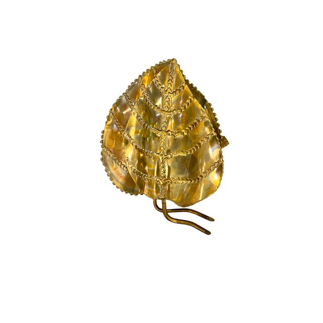 Pair of Maison Jansen-style wall sconces, French, 20th century. Each sconce consists of two gilded leaves, the back one...