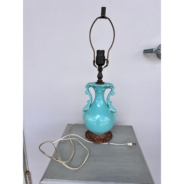 Tiffany , Turquoise ceramic body. The urn shape body reminds me of a ceramic McCoy Vase from the 1930s. The detailed base...