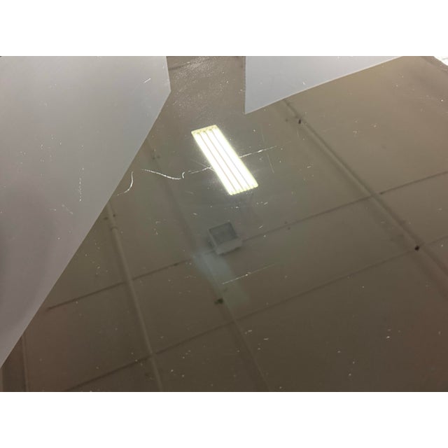 Design Plus Gallery presents a Bespoke Metal + Glass Large Dining Table from Coup d'Etat. The elongated oval top has a...