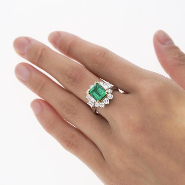 A magnificent natural emerald and diamond ring in 18k white and yellow gold. Set with a 2.55 carat Colombian emerald...