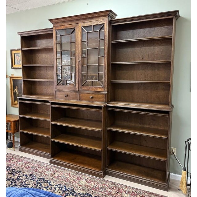 This monumental custom-built mahogany bookcase is an open-air contemporary shelving system thoughtfully constructed around...
