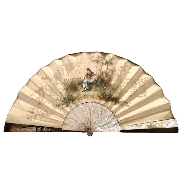 On offer is a stunning example of an antique European folding fan, dating roughly from the late 19th century to early 20th...