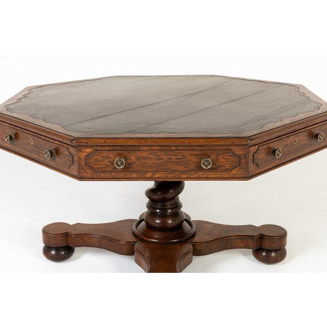 Large 19th century english oak drum table a large octagonal 19th century english oak drum table. this table top has a...