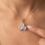 An ethereal three-stone design featuring round-cut natural moonstones arranged in a graceful trefoil formation, secured in...