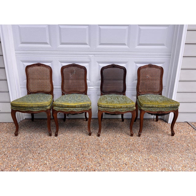 Lovely set of four cane-back dining chairs from Richard Wheelright. Original blue and green damask seats and the original...
