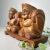 Two exquisitely hand-carved wooden figures, resting atop an elegantly undulating base, depict the beloved Japanese gods of...