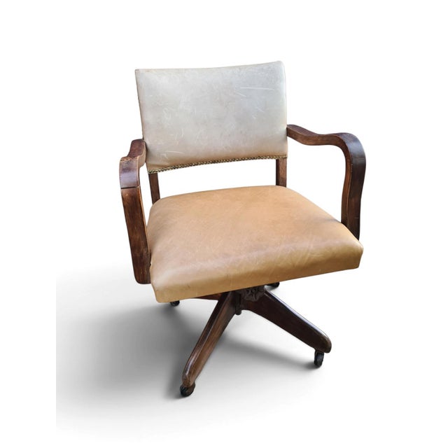 An original english office armchair by hillcrest, dating from the first half of the 20th century, most likely from around...