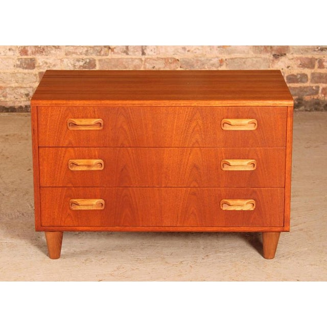A mid century g plan fresco chest of three drawers on new tapered legs, circa 1960s. Excellent restored condition. H: 54cm...