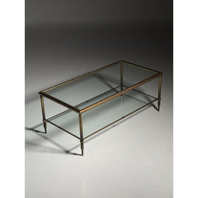 Mid-century coffee table with 2 glass tops. In good condition! Only light signs of use commensurate with age. Dimensions:...