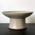 A ceramic dish with high cylindrical foot in white glaze from Korea, circa 19th century Joseon Dynasty. By shape, this...