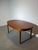A beautifully crafted mid-century modern dining table by Nathan Furniture, executed in warm teak and featuring an elegant...