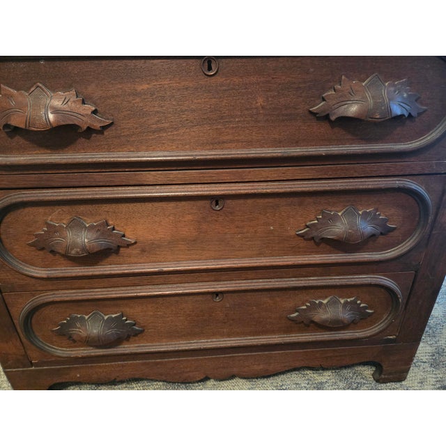 This piece is a beautiful antique Victorian era 3-drawer dresser from the Eastlake movement. The piece is believed to be...