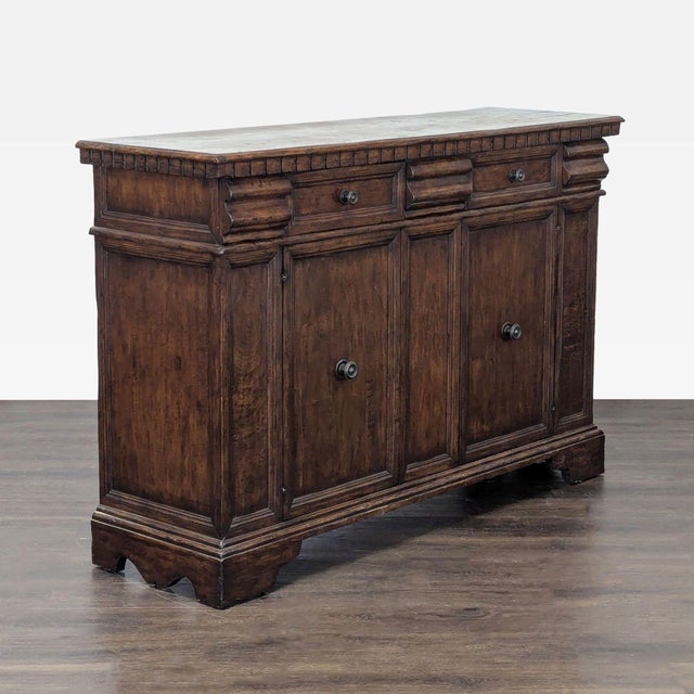 Antiqued and painted walnut credenza with five drawers, two doors & one fixed shelf. The credenza has panelled doors and...