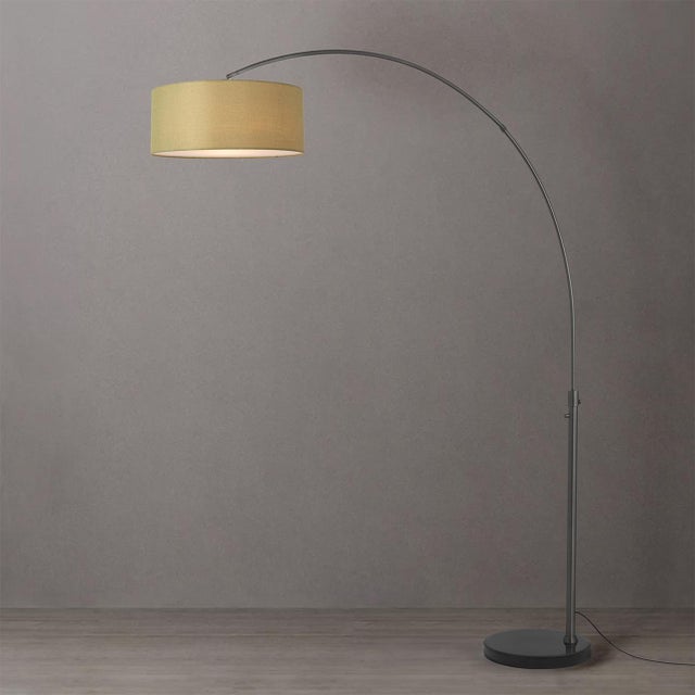 The Float 92" Arc Lamp is a modern arc lamp designed by Peter Morelli in 1960, featuring a sweeping silhouette and a black...