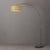 The Float 92" Arc Lamp is a modern arc lamp designed by Peter Morelli in 1960, featuring a sweeping silhouette and a black...
