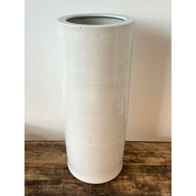 Elevate your entryway with this sophisticated vintage studio pottery umbrella stand, a masterclass in minimalist design....