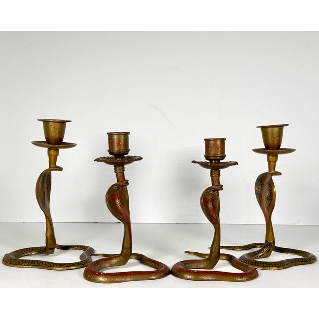 Collection of Four Brass Cobra Candlesticks for your consideration. The larger two measure approx. 6 5/8 inches tall and...