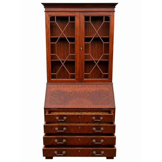 English mahogany writing desk with an elegant glass-fronted cabinet. Very good condition. Dimensions: Height 101 cm, Width...