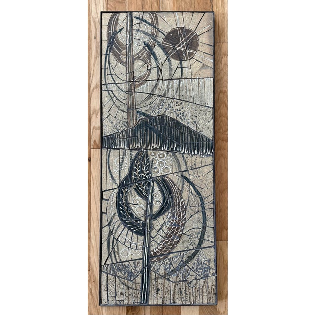 Vintage mid century style ceramic tile mosaic wall art piece framed in a steel metal frame. The piece features an abstract...
