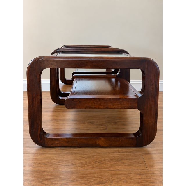 Striking pair of vintage Mersman Bellaire side tables featuring sculptural cantilevered wood frames, inset glass tops, and...