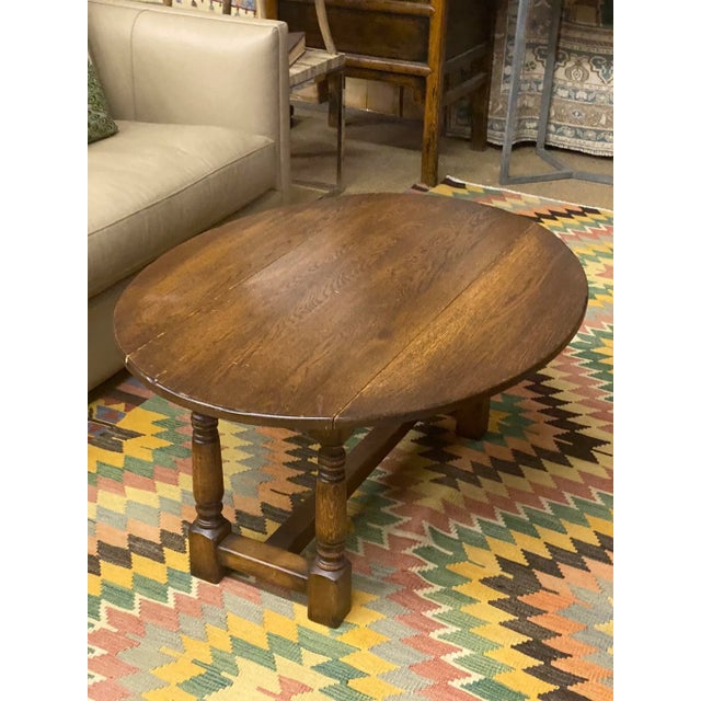 Solid and practical vintage English Oak drop leaf Coffee Table. Would make a nice addition to your home decor!