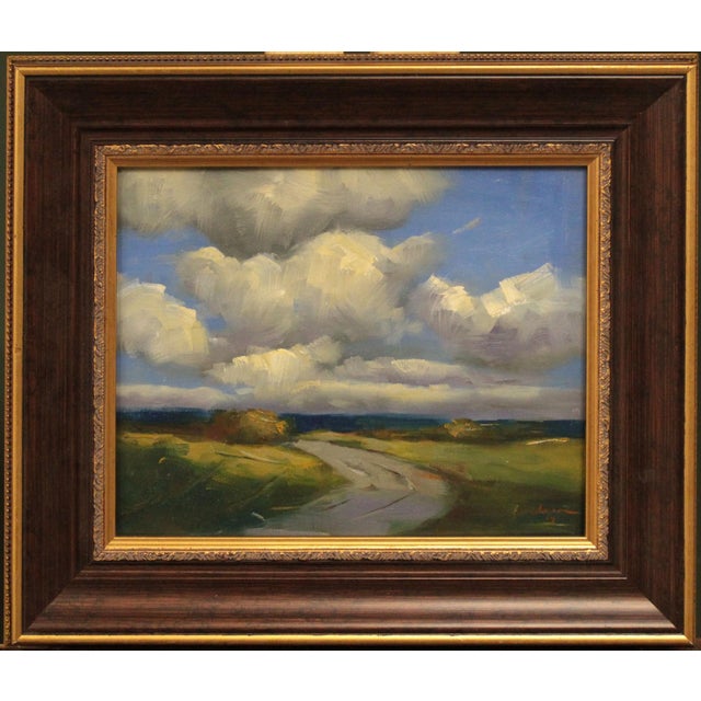 This oil on canvas board artwork captures a tranquil Colorado landscape, where rolling fields meet a dramatic sky filled...