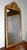 Rectangular mirror with gilded wood frame, festooned with hollow and projecting motifs. The latter are slightly coppered,...