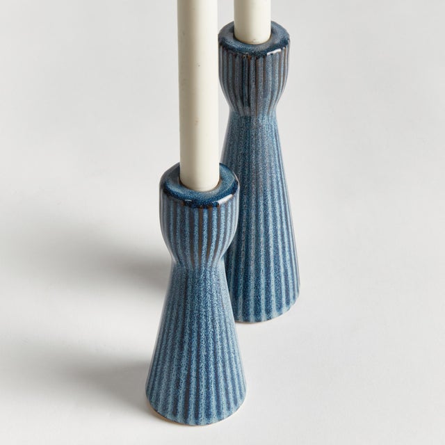 Made of a highfired, durable stoneware, and finished with a dynamic reactive glaze, these candle stands are a beautiful...