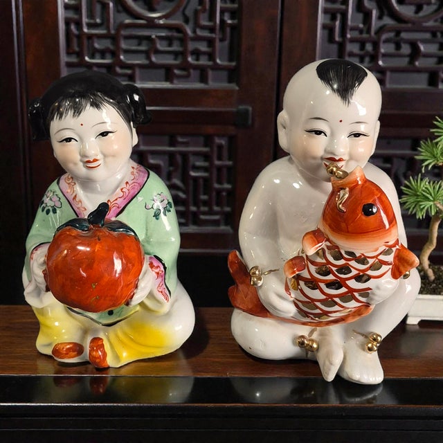 The product is a set of vintage Asian hand-painted porcelain figures depicting lucky children, a common theme in Chinese...